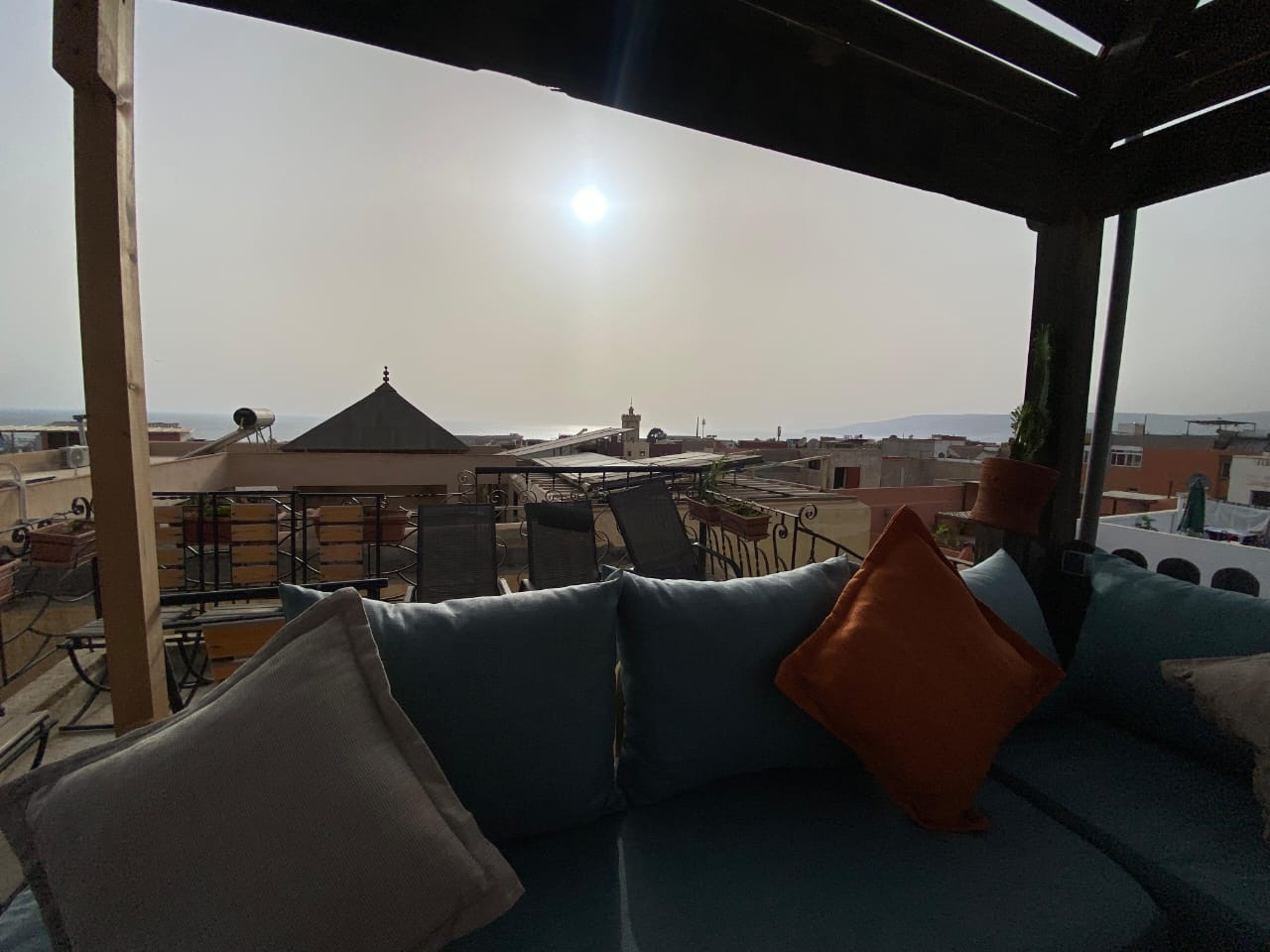 Guests relaxing on the rooftop terrace of the Last Drop house, overlooking Taghazout and the ocean